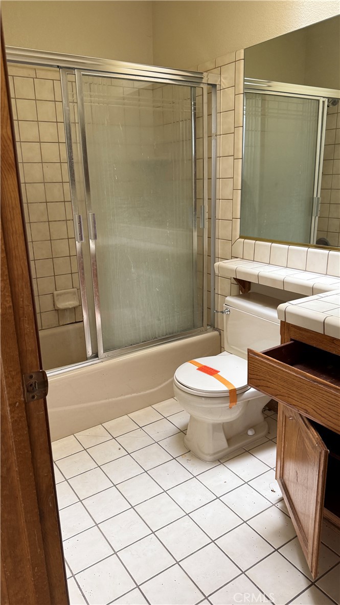 13116 Rincon Road Apple Valley, CA 92308 - Photo 14 of 62 a bathroom with a sink a toilet and shower