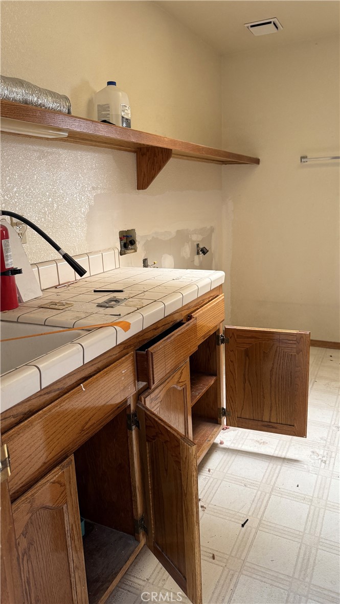 13116 Rincon Road Apple Valley, CA 92308 - Photo 15 of 62 a utility room with dryer and washer