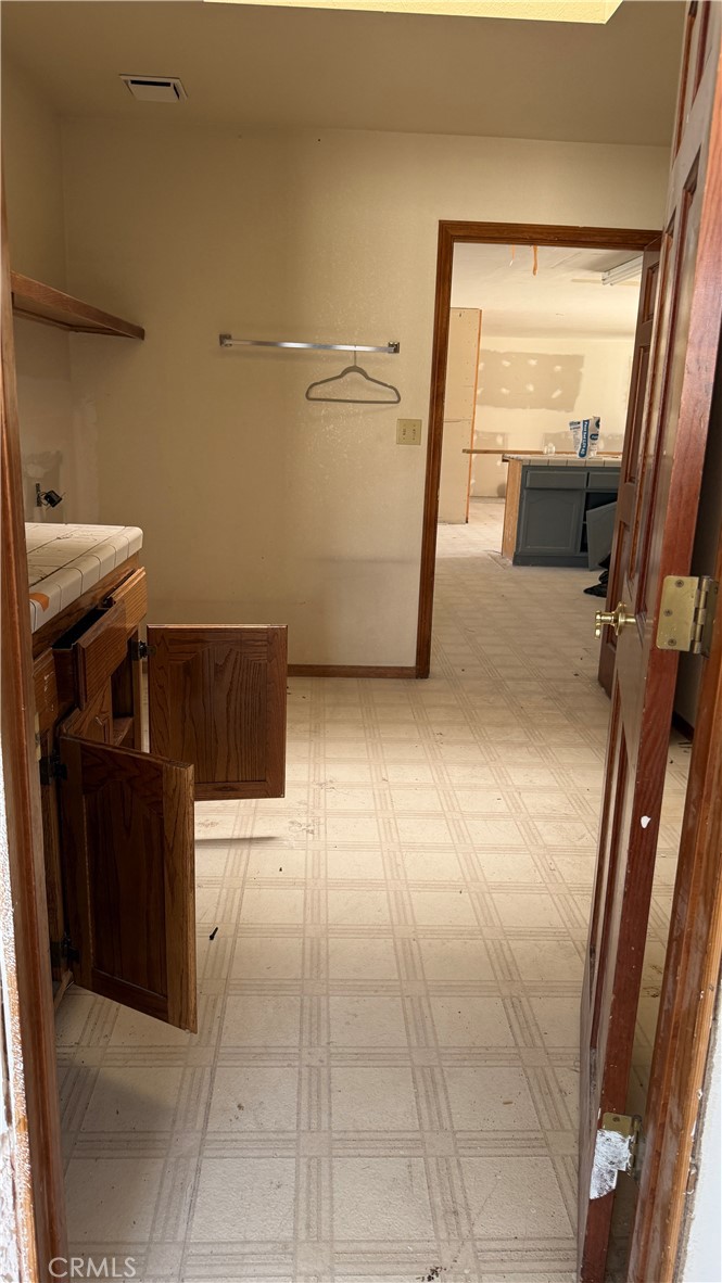 13116 Rincon Road Apple Valley, CA 92308 - Photo 16 of 62 a view of a storage & utility room in a house