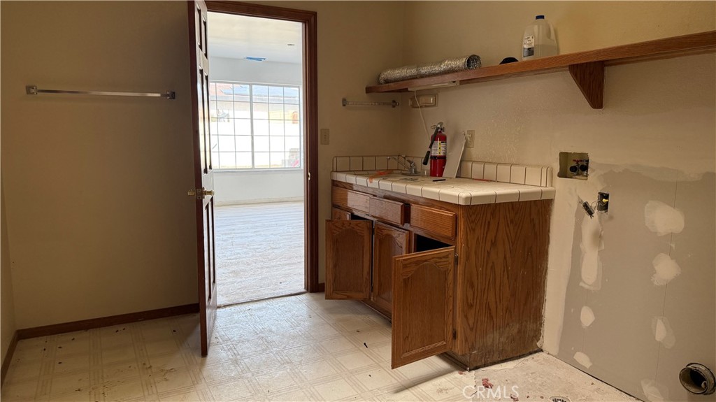 13116 Rincon Road Apple Valley, CA 92308 - Photo 17 of 62 a utility room with a window