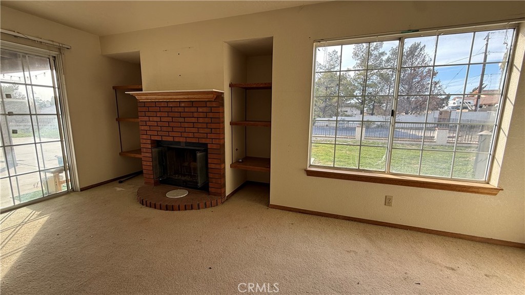 13116 Rincon Road Apple Valley, CA 92308 - Photo 20 of 62 an empty room with windows