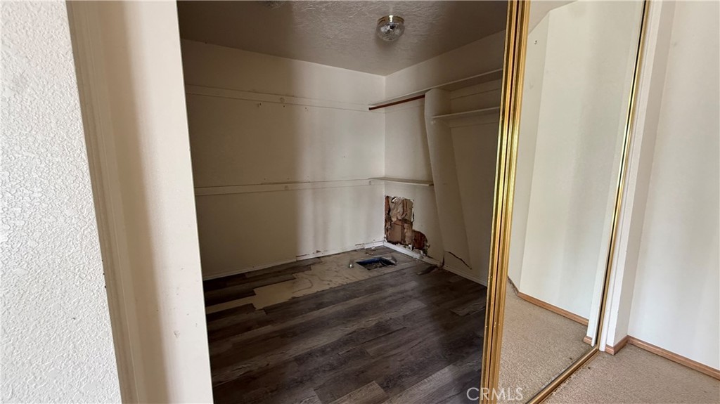 13116 Rincon Road Apple Valley, CA 92308 - Photo 22 of 62 a view of small space with wooden floor