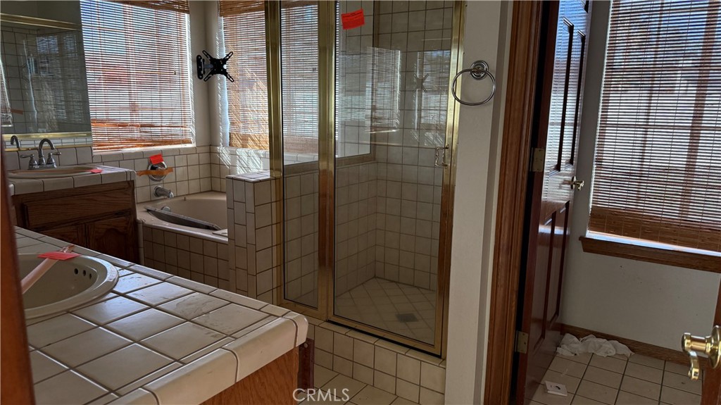 13116 Rincon Road Apple Valley, CA 92308 - Photo 24 of 62 a bathroom with a shower