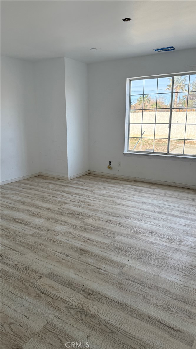 13116 Rincon Road Apple Valley, CA 92308 - Photo 27 of 62 a view of an empty room with a window
