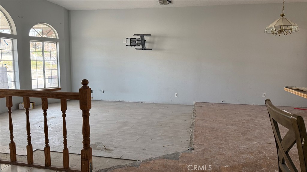 13116 Rincon Road Apple Valley, CA 92308 - Photo 32 of 62 a view of a livingroom with wooden floor and window