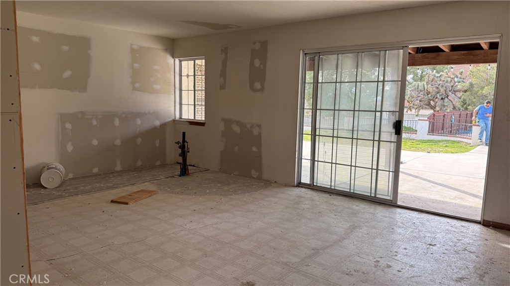 13116 Rincon Road Apple Valley, CA 92308 - Photo 33 of 62 an empty room with sliding door