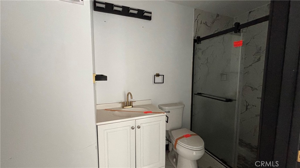 13116 Rincon Road Apple Valley, CA 92308 - Photo 41 of 62 a bathroom with a sink toilet and a mirror