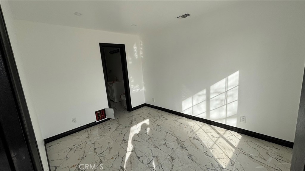 13116 Rincon Road Apple Valley, CA 92308 - Photo 43 of 62 a view of an empty room and wooden floor