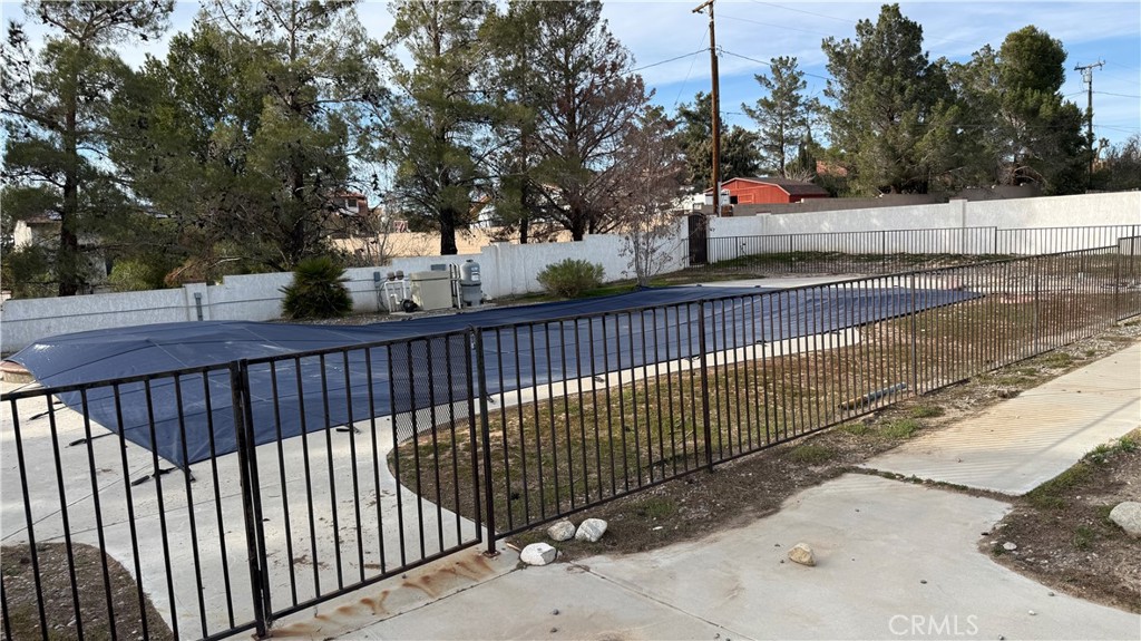 13116 Rincon Road Apple Valley, CA 92308 - Photo 48 of 62 a view of a street with a trees in the background