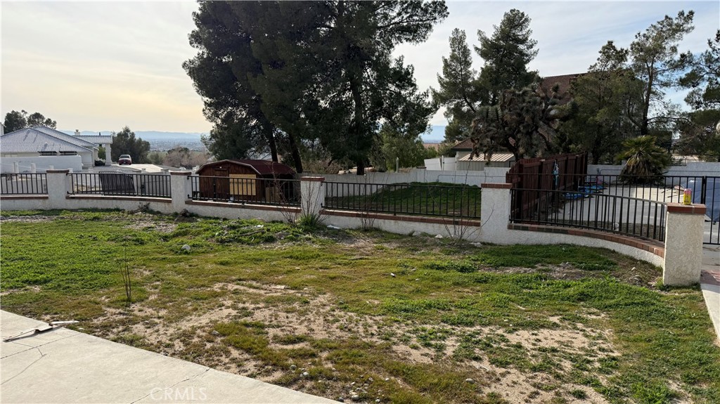 13116 Rincon Road Apple Valley, CA 92308 - Photo 49 of 62 a backyard of a house with lots of green space