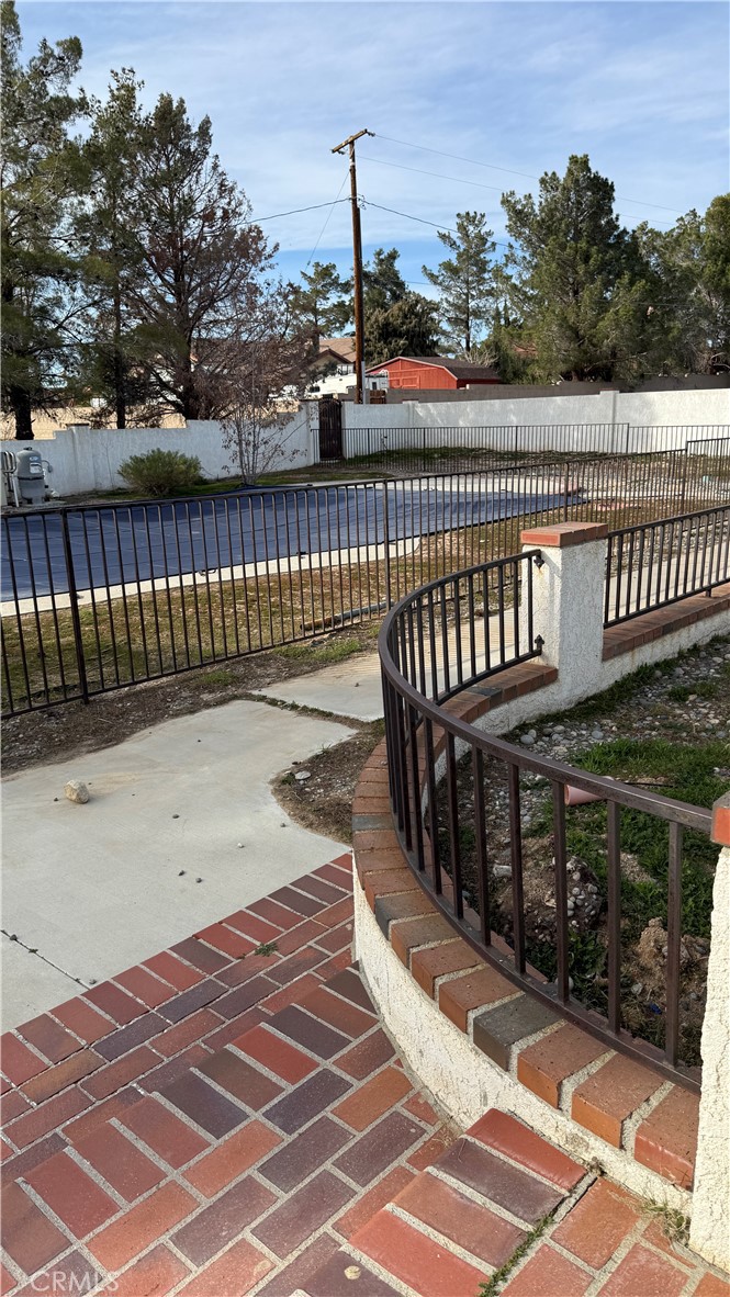 13116 Rincon Road Apple Valley, CA 92308 - Photo 53 of 62 a view of street with wooden deck