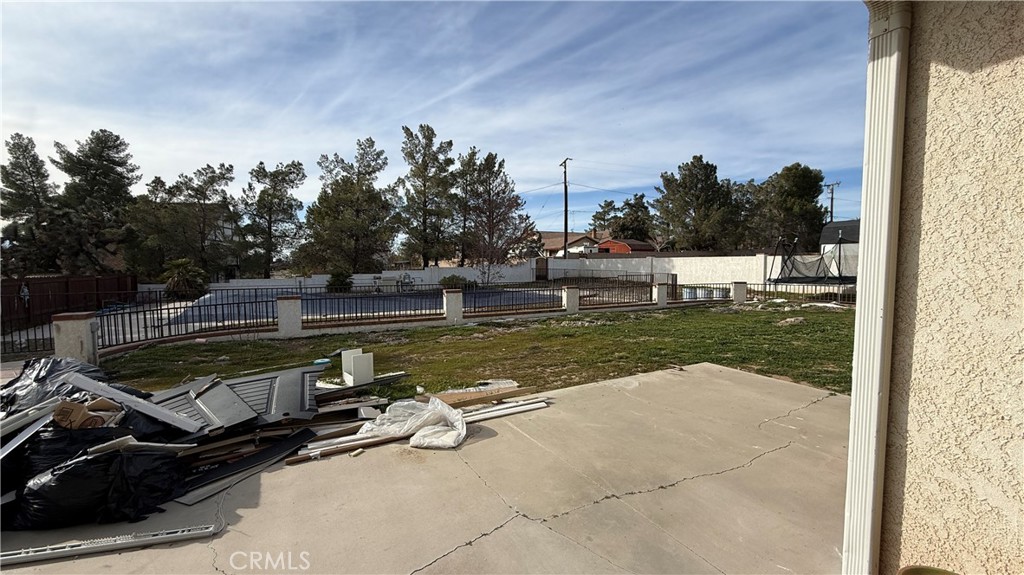 13116 Rincon Road Apple Valley, CA 92308 - Photo 58 of 62 a view of a swimming pool with a yard