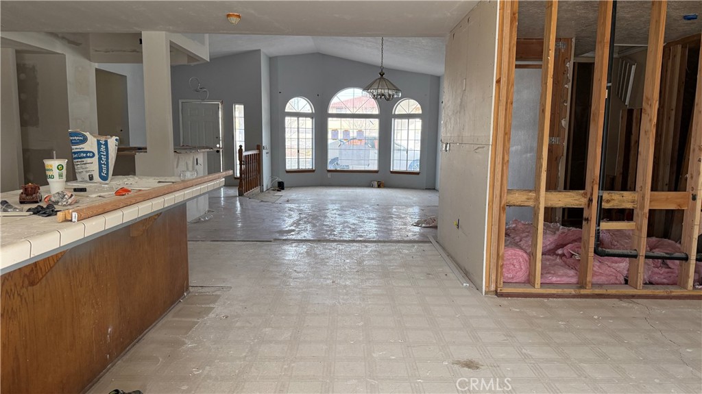 13116 Rincon Road Apple Valley, CA 92308 - Photo 6 of 62 a large bathroom with a large mirror vanity and a shower