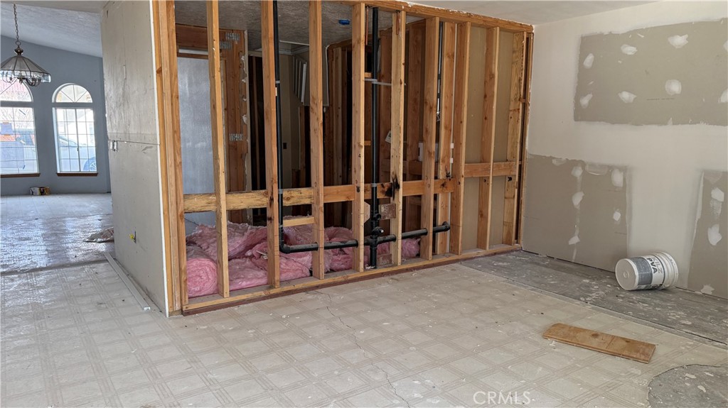 13116 Rincon Road Apple Valley, CA 92308 - Photo 8 of 62 a view of a room with wooden floor and windows