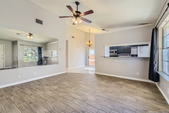a view of a kitchen with a sink and a stove top oven