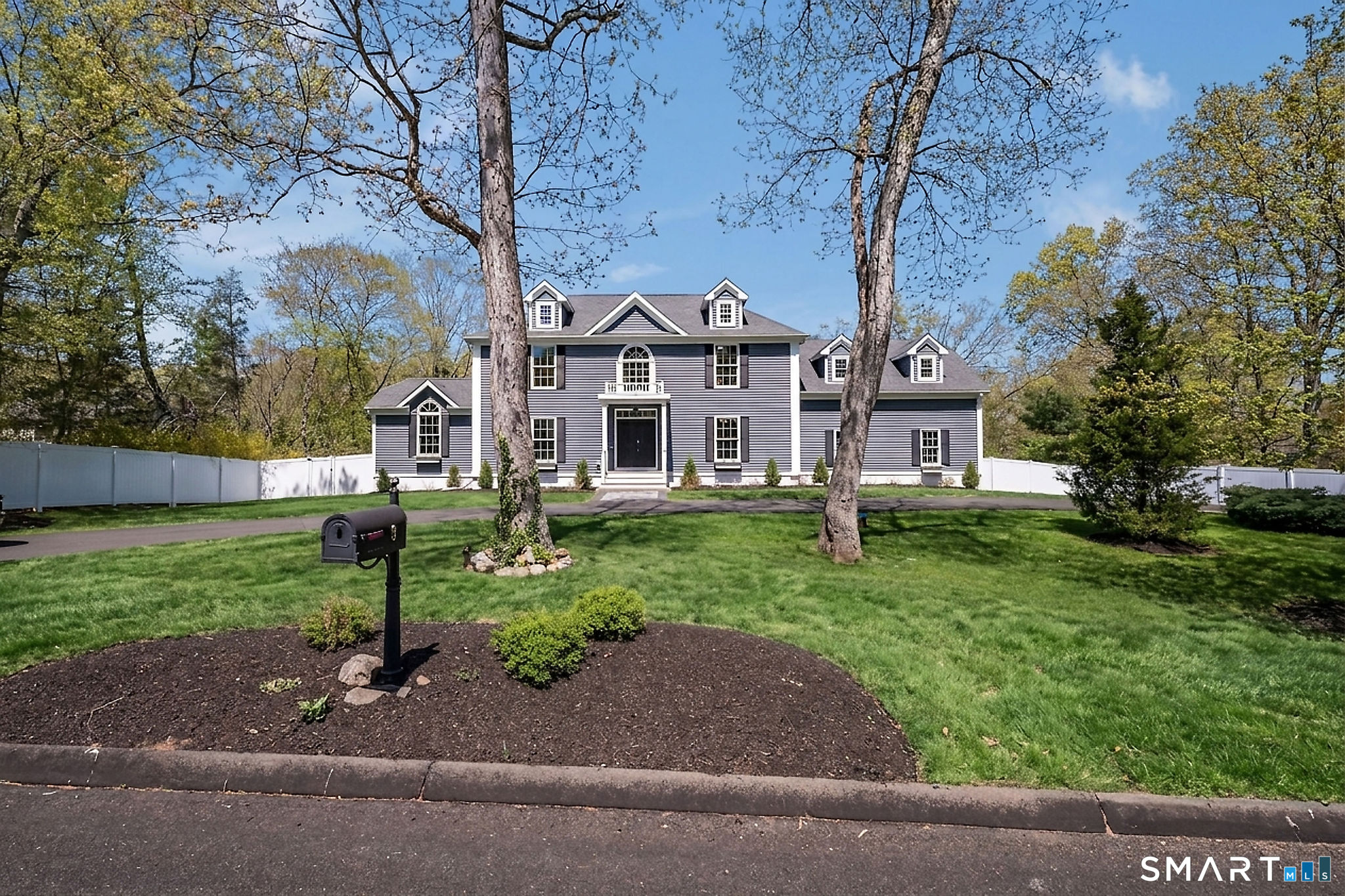 9 Sunset Ridge Drive Guilford, CT 06437 - Photo 2 of 40 a front view of a house with garden