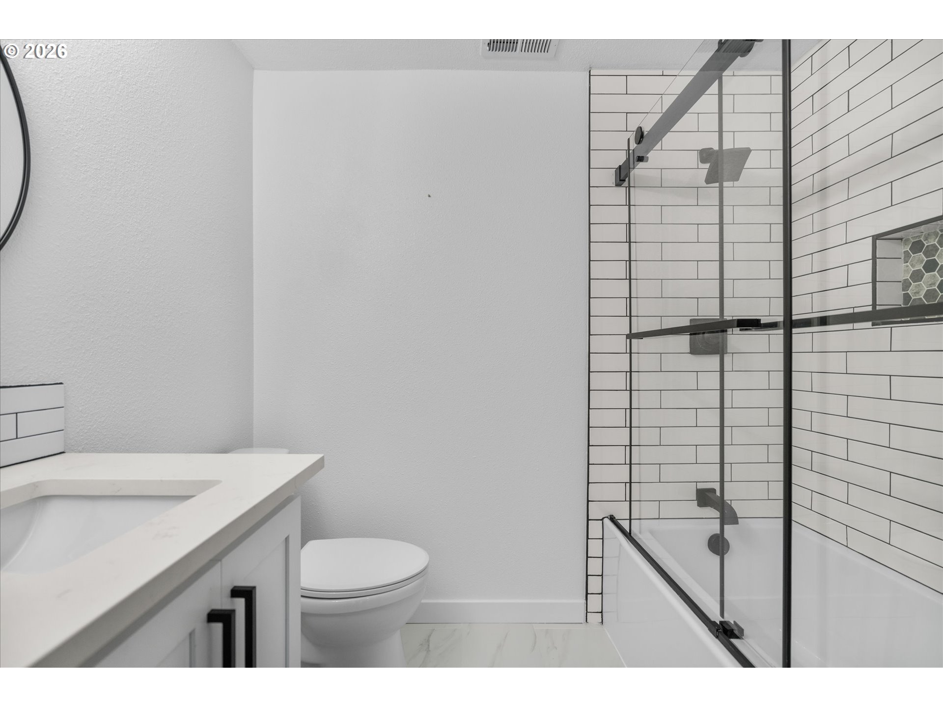 602 South Vermont Street Portland, OR 97219 - Photo 11 of 46 a bathroom with a granite countertop sink toilet and shower