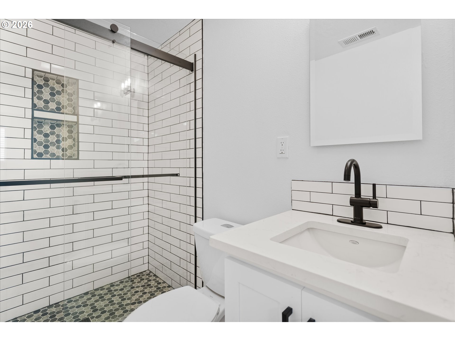 602 South Vermont Street Portland, OR 97219 - Photo 17 of 46 a bathroom with a sink and a mirror