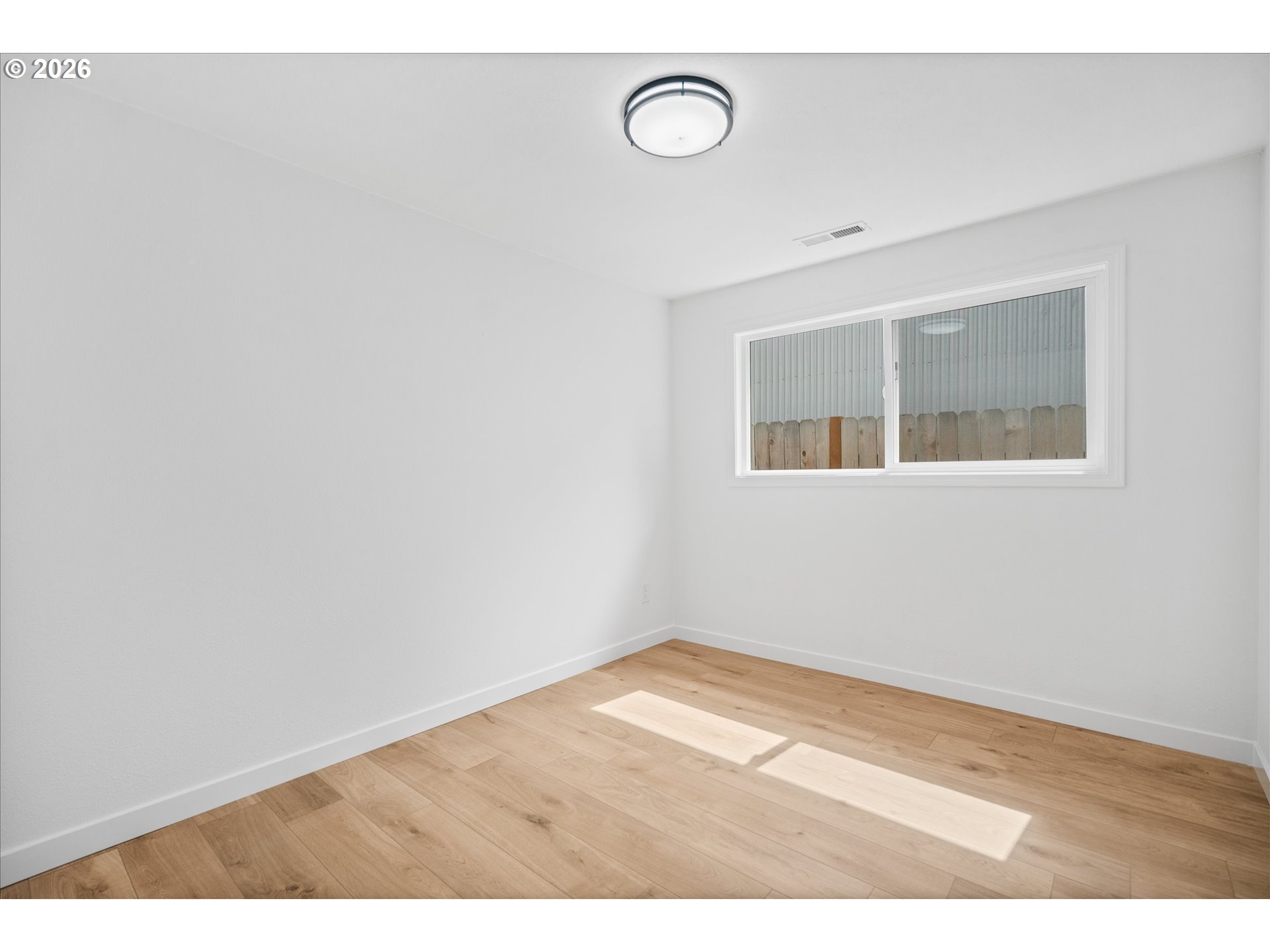602 South Vermont Street Portland, OR 97219 - Photo 18 of 46 a view of empty room with wooden floor
