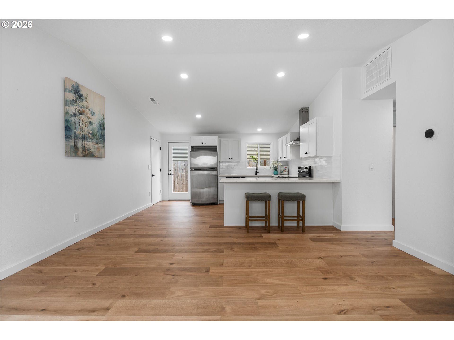 602 South Vermont Street Portland, OR 97219 - Photo 20 of 46 a view of kitchen with kitchen island microwave and refrigerator