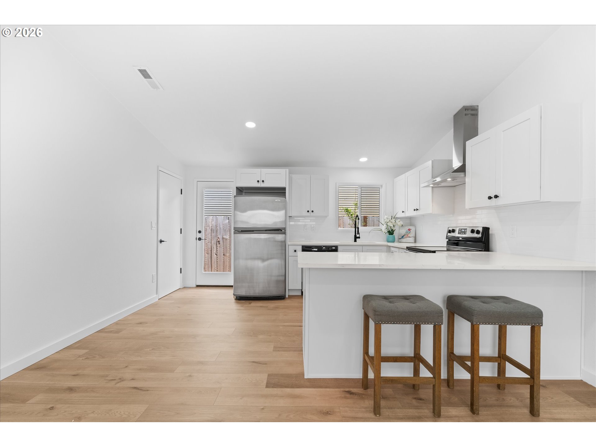 602 South Vermont Street Portland, OR 97219 - Photo 24 of 46 a kitchen with stainless steel appliances a refrigerator sink and cabinets