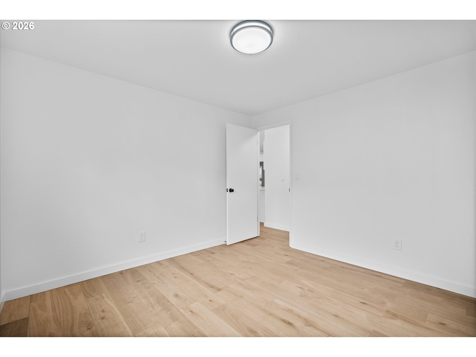 602 South Vermont Street Portland, OR 97219 - Photo 29 of 46 a view of an empty room with wooden floor