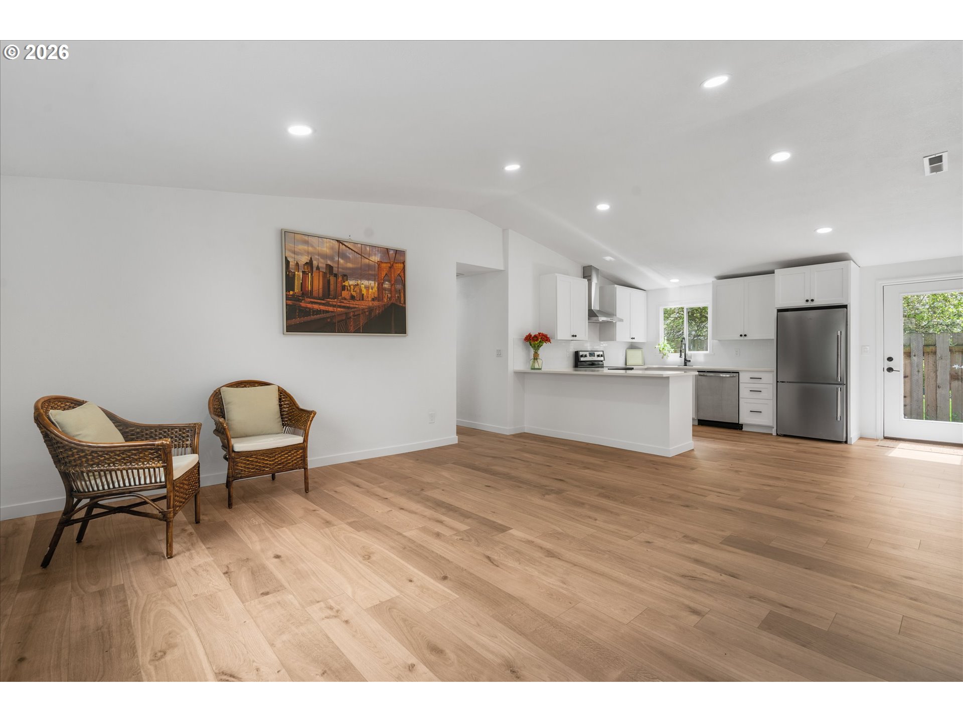 602 South Vermont Street Portland, OR 97219 - Photo 4 of 46 a view of a kitchen with furniture and wooden floor