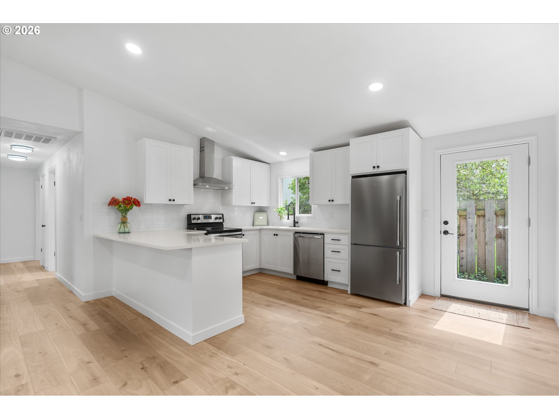 602 South Vermont Street Portland, OR 97219 - Photo 6 of 46 a kitchen with a refrigerator and a sink