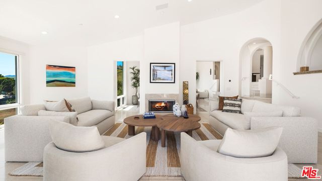 a view of a terrace with couches and city view