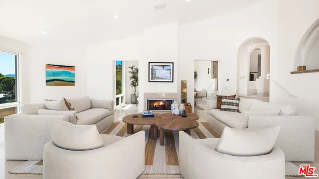 a view of a terrace with couches and city view