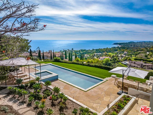 a view of a garden with an ocean