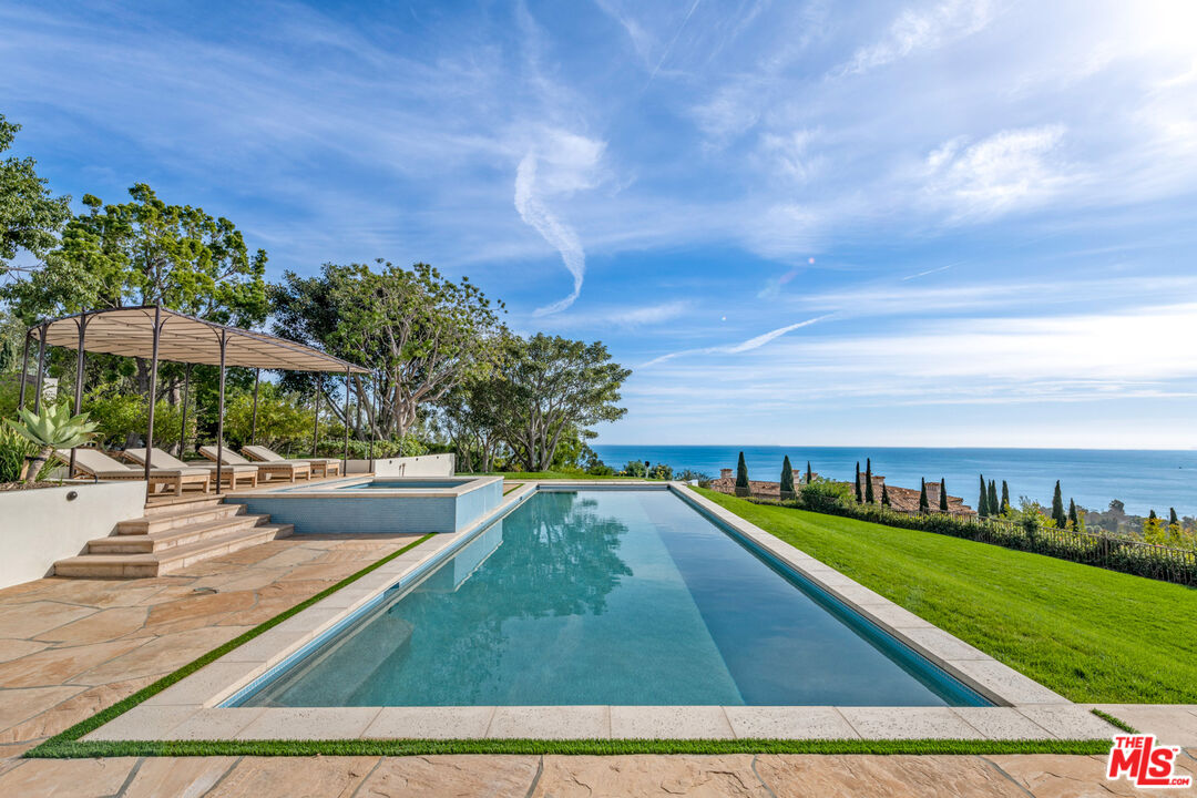27445 Winding Way Malibu, CA 90265 - Photo 19 of 59 a view of a swimming pool with an outdoor seating