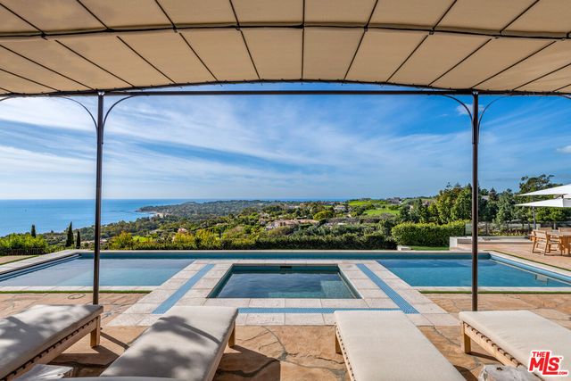 a view of a swimming pool with a patio