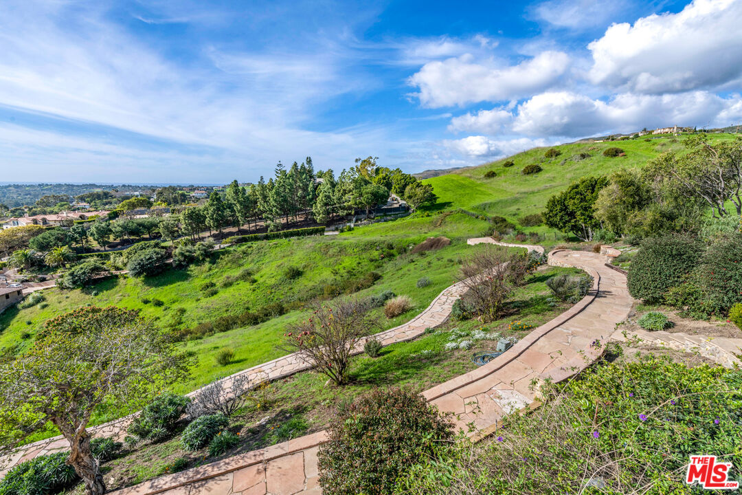27445 Winding Way Malibu, CA 90265 - Photo 22 of 59 a view of a garden with an ocean