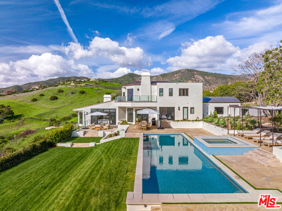 27445 Winding Way Malibu, CA 90265 - Photo 26 of 59 a view of a swimming pool with a patio