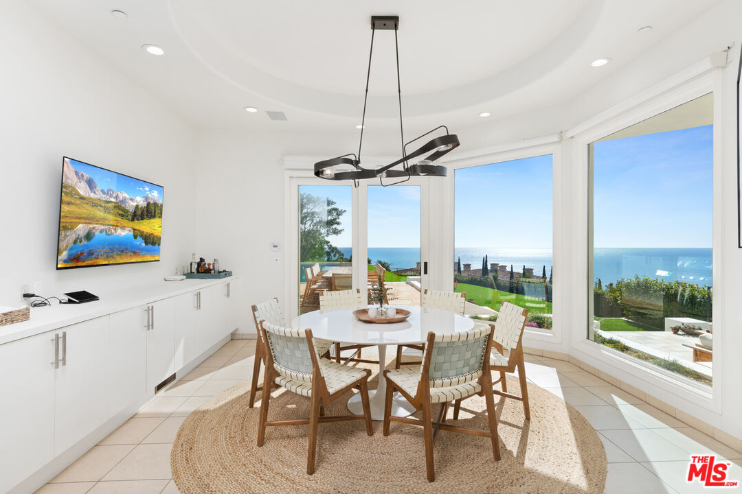 27445 Winding Way Malibu, CA 90265 - Photo 29 of 59 a view of a dining room with furniture window and outside view