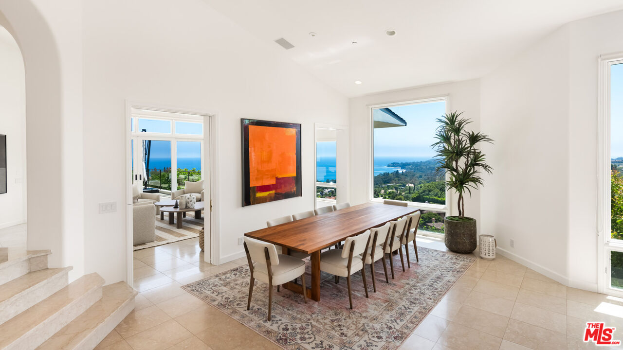 27445 Winding Way Malibu, CA 90265 - Photo 30 of 59 a view of a dining room with furniture and a potted plant