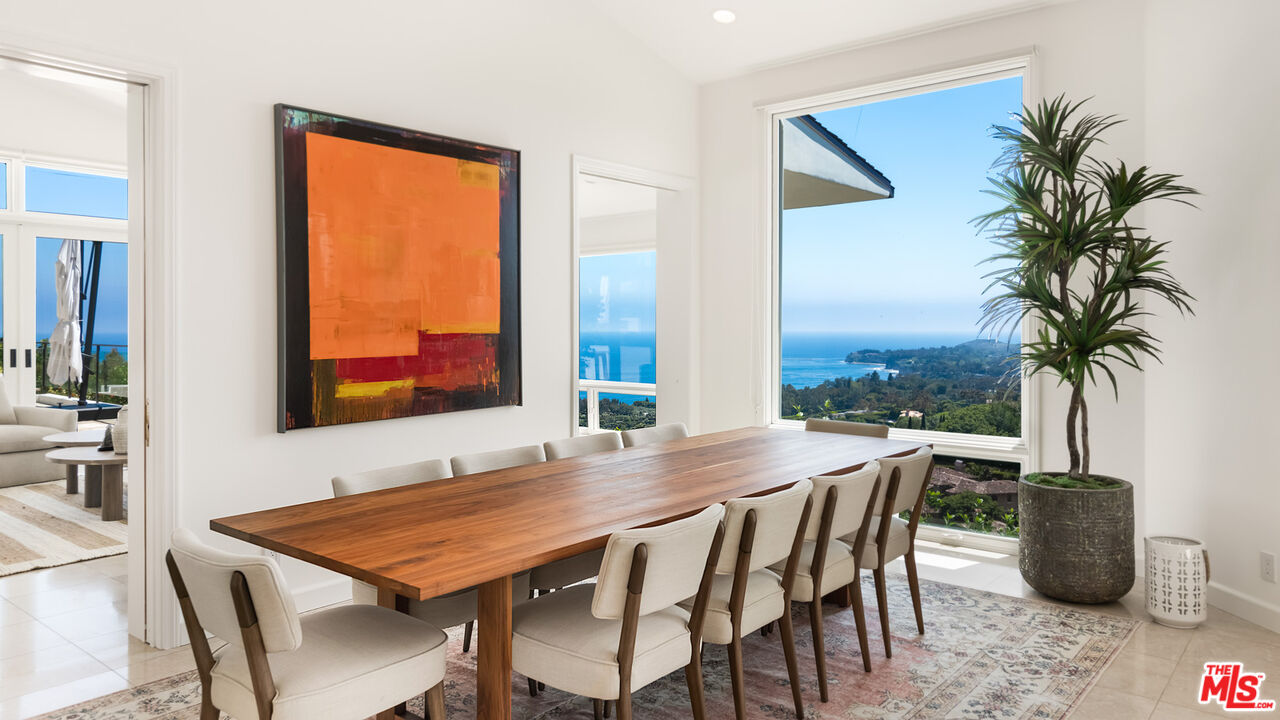 27445 Winding Way Malibu, CA 90265 - Photo 31 of 59 a view of a dining room with furniture window and wooden floor
