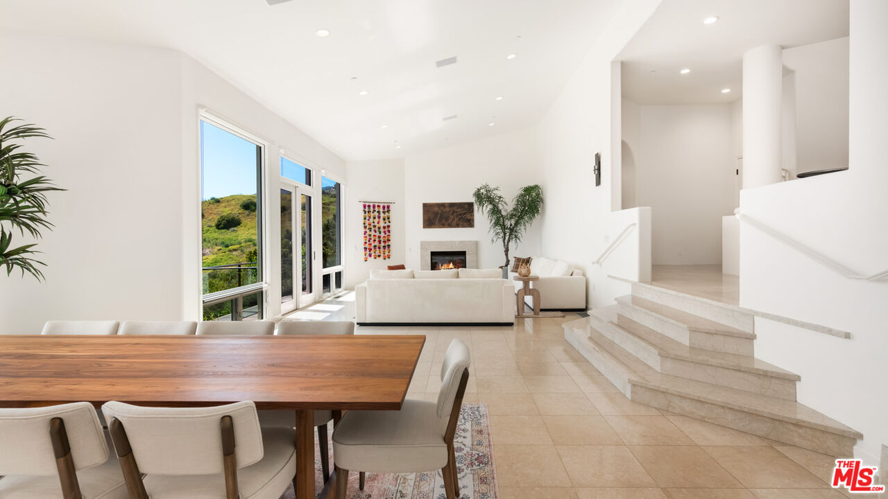 27445 Winding Way Malibu, CA 90265 - Photo 33 of 59 a living room with furniture and a large window