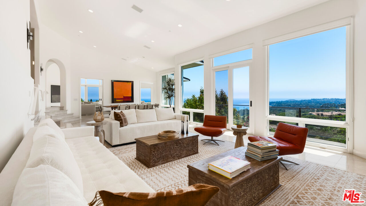 27445 Winding Way Malibu, CA 90265 - Photo 36 of 59 a living room with fireplace furniture and a flat screen tv