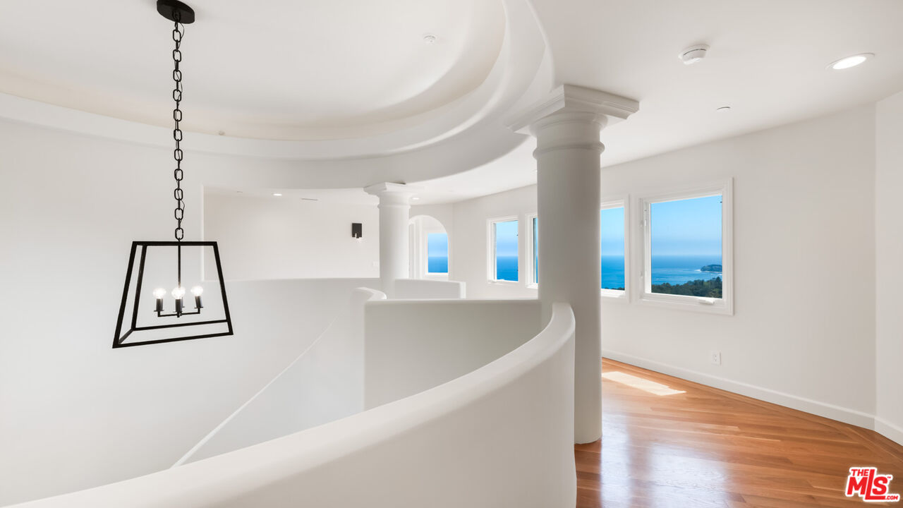 27445 Winding Way Malibu, CA 90265 - Photo 37 of 59 a view of a room with window and wooden floor
