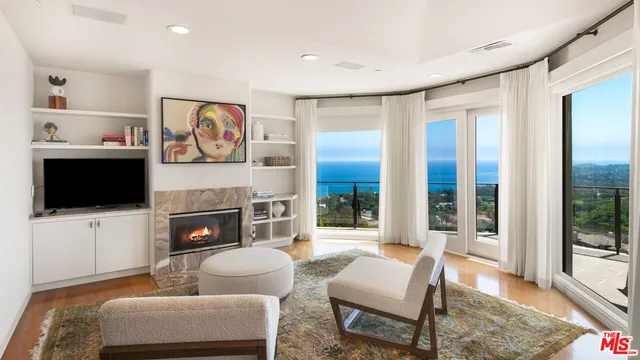 a bedroom with a bed and glass window