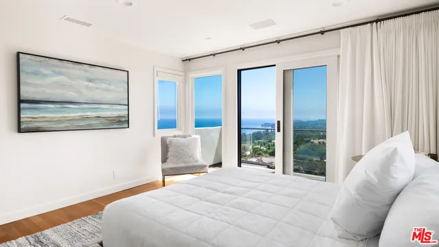 a view of swimming pool with lawn chairs and a big yard