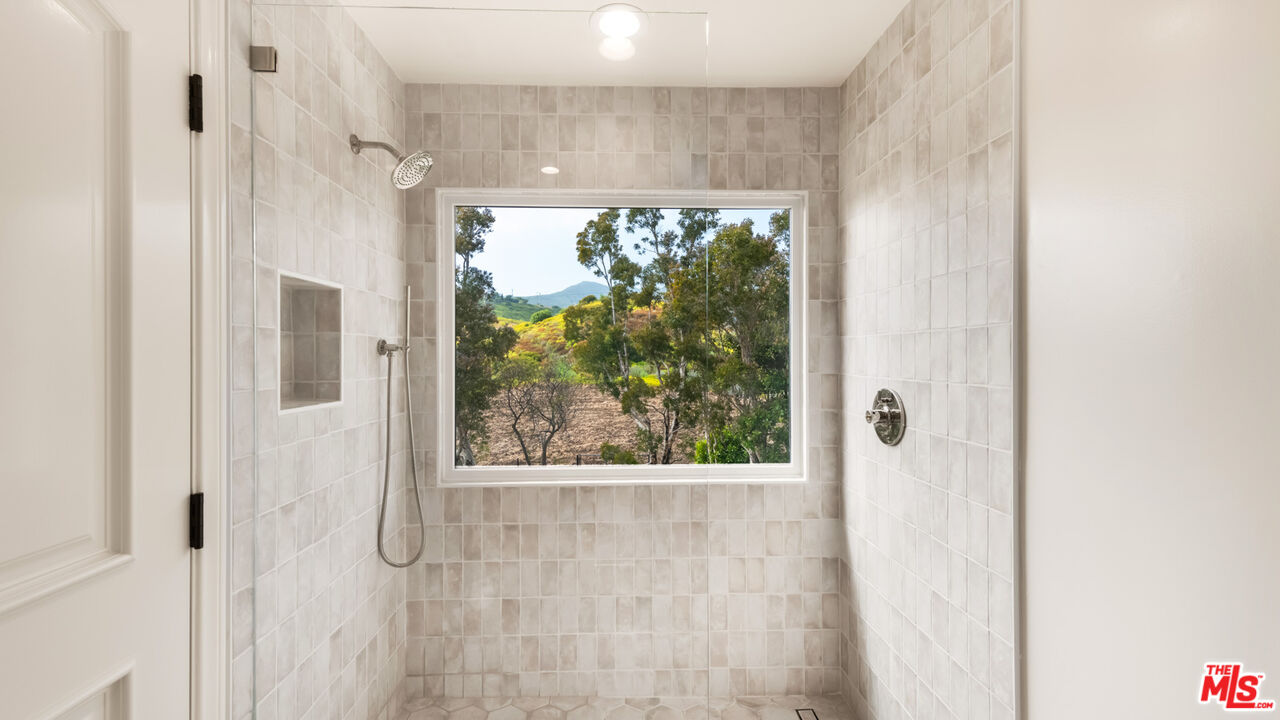 27445 Winding Way Malibu, CA 90265 - Photo 49 of 59 a bathroom with a large window
