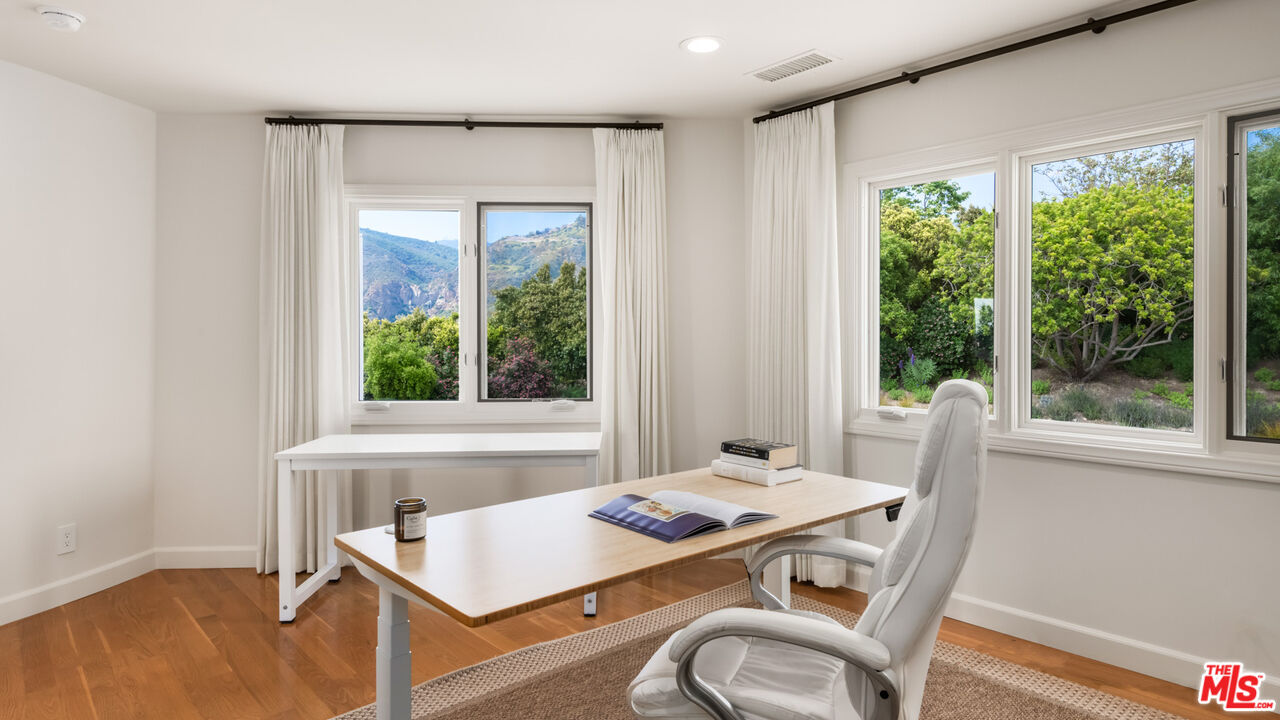 27445 Winding Way Malibu, CA 90265 - Photo 50 of 59 a view of a dining room with furniture window and outside view