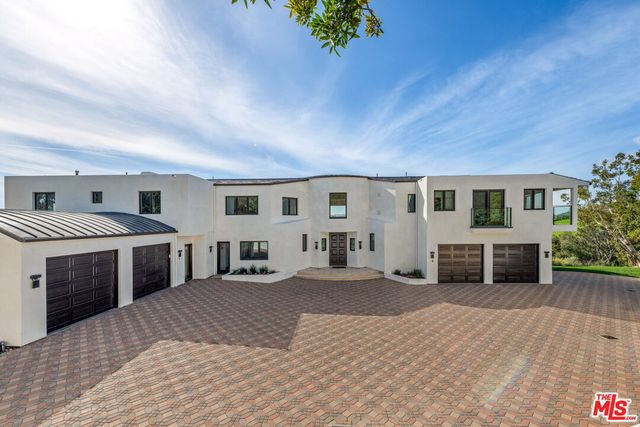 a view of living room filled with furniture and window