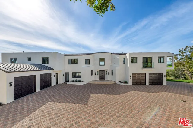 a view of living room filled with furniture and window