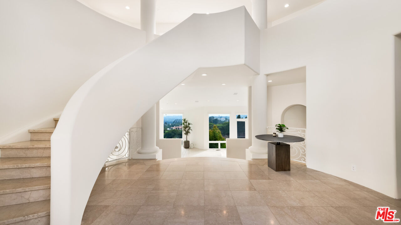 27445 Winding Way Malibu, CA 90265 - Photo 6 of 59 a view of living room filled with furniture and window