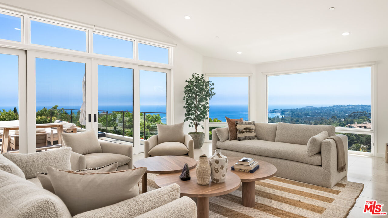 27445 Winding Way Malibu, CA 90265 - Photo 9 of 59 a living room with furniture and a large window