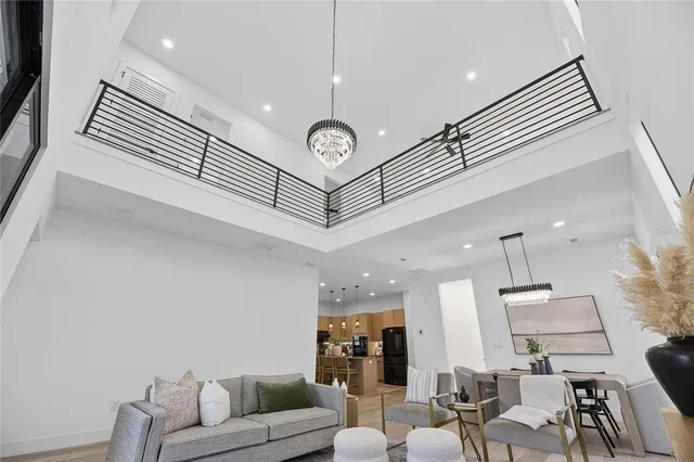 a kitchen with stainless steel appliances kitchen island granite countertop a refrigerator and a stove top oven